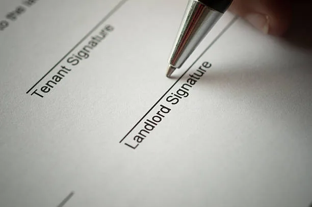 Landlord signing rental agreement form